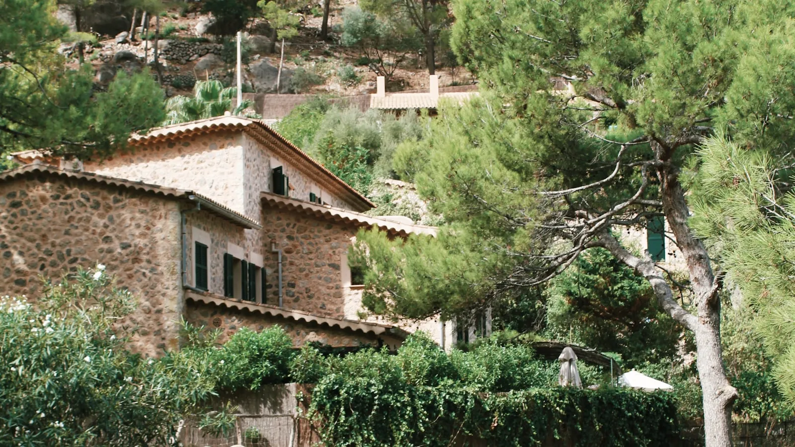 Mallorcan stone house surrounded by pine trees in the countryside