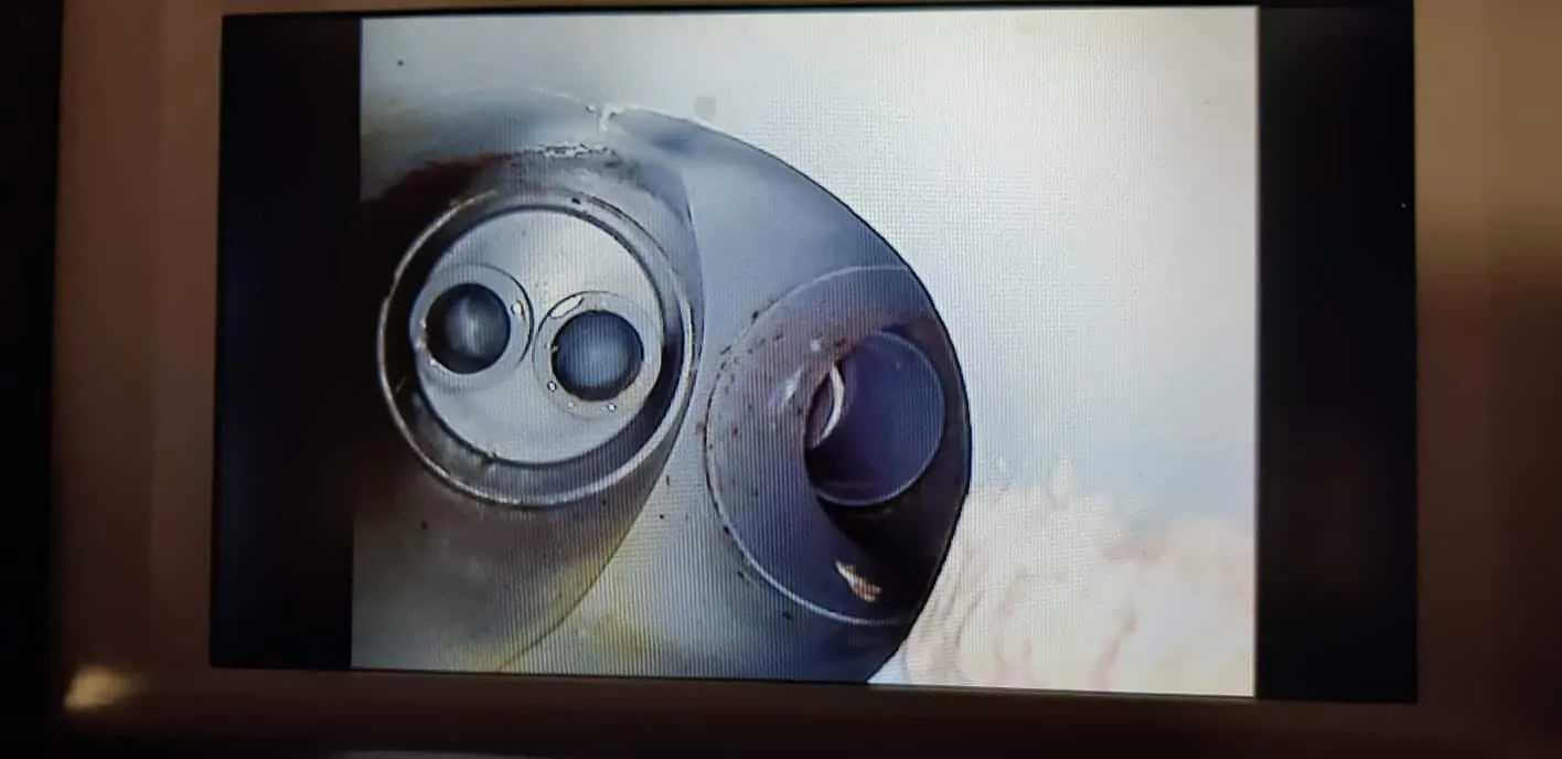 Monitor showing a live CCTV camera feed from inside a pipe