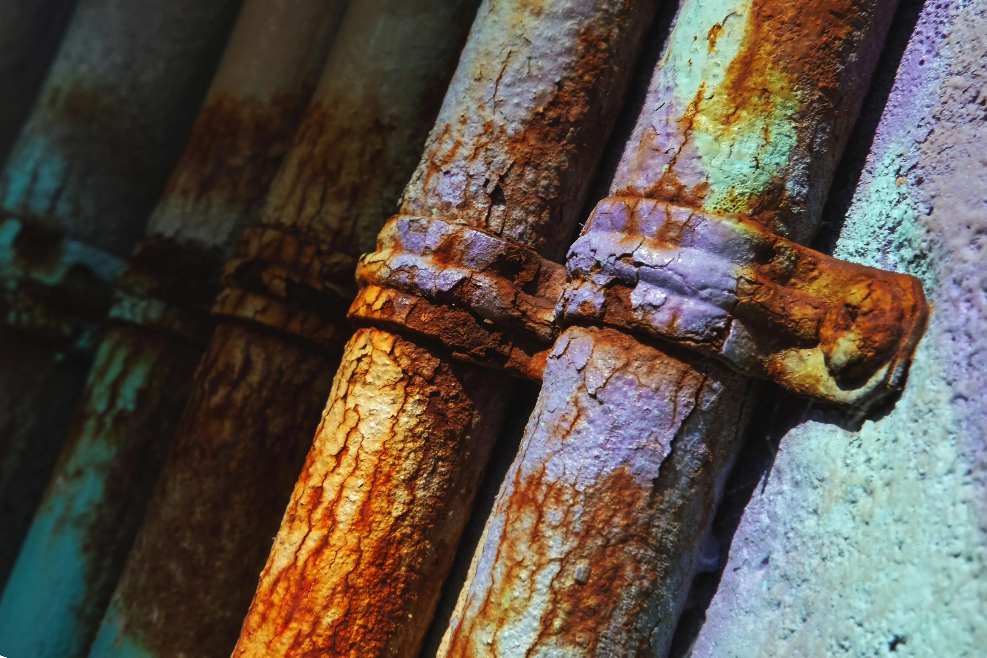 Corroded industrial pipes with visible rust damage